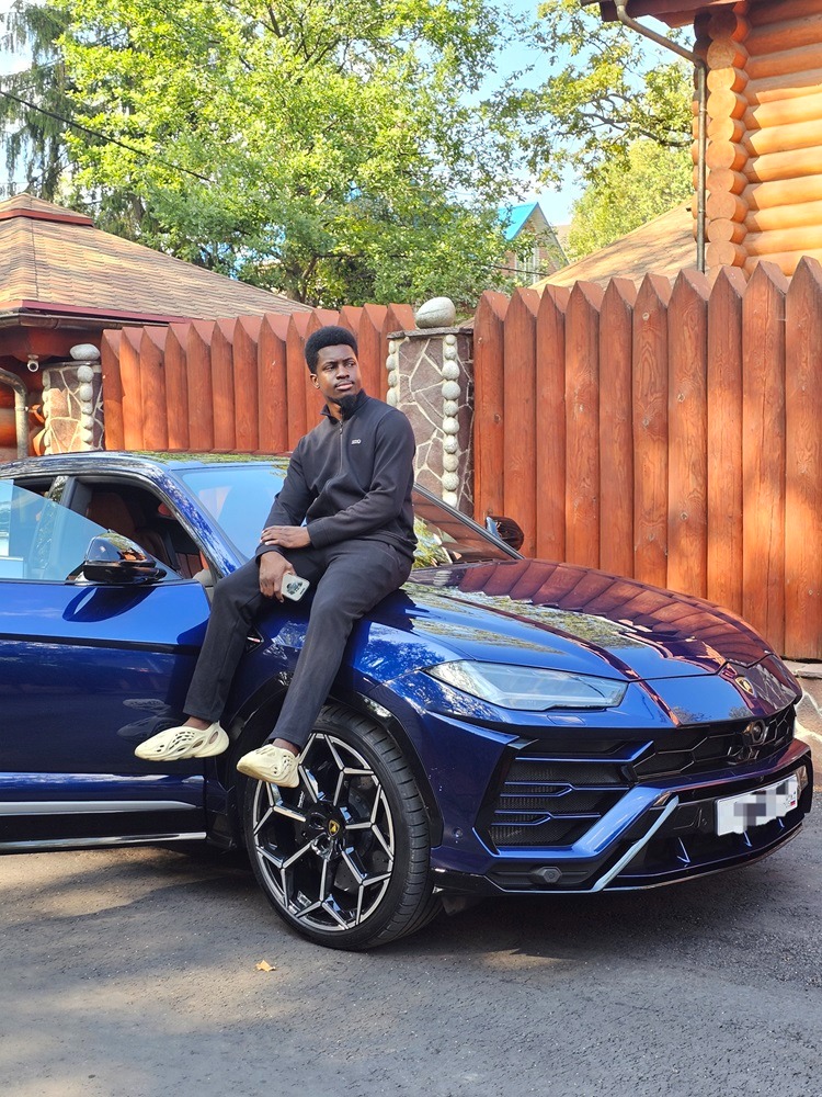 Mr P Fx Founder Omoike Victory with Blue Lamborghini